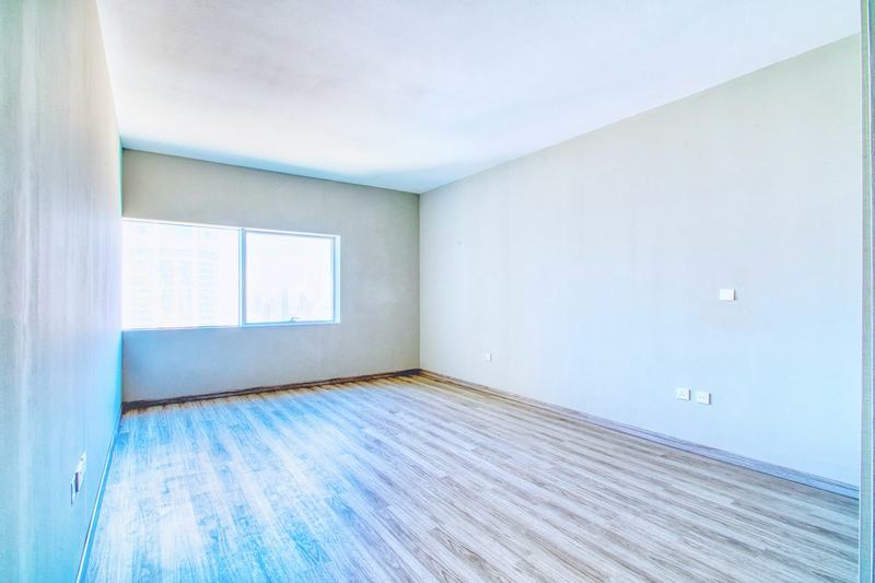 Bedroom before staging: empty room
